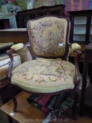An elegant framed, broad seated Elbow Chair having cabriole front legs and swept rear legs,