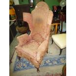 A fine old Georgian design Wing fireside Armchair standing on brief cabriole front legs with