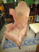 A fine old Georgian design Wing fireside Armchair standing on brief cabriole front legs with