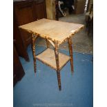 A rectangular cane Conservatory Table having woven top and surface tot he lower shelf,