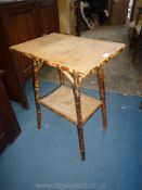 A rectangular cane Conservatory Table having woven top and surface tot he lower shelf,