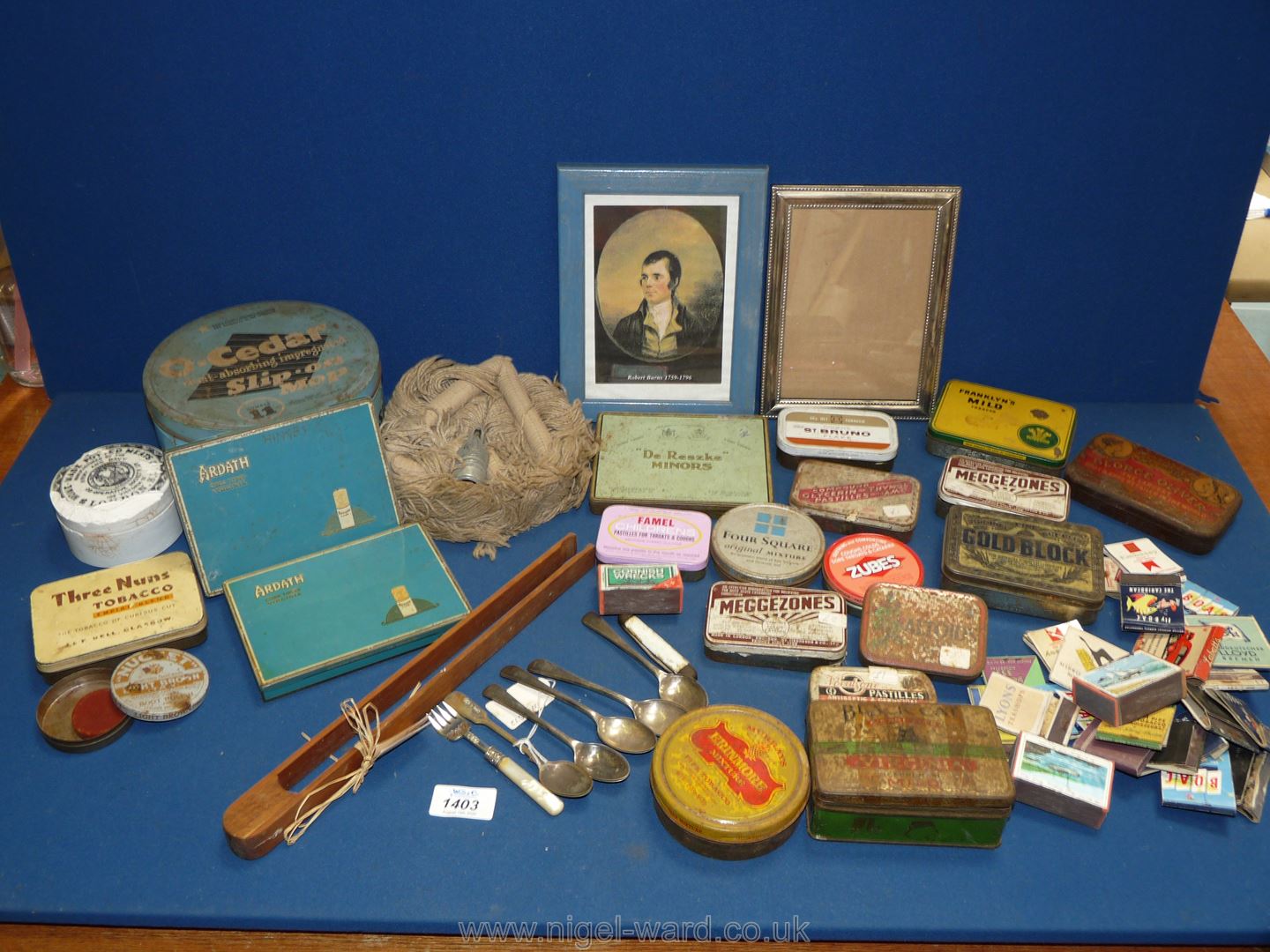 A box of collectible tins, matchboxes, teaspoons etc.