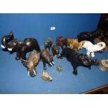 A quantity of Elephant figures in wood, onyx, ceramic, etc., (some a/f).