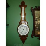 A wooden cased banjo Aneroid Barometer/thermometer.