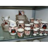 An Imari style teaset, bread and butter plates, small plates, breakfast cups, coffee cups, egg cups,