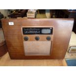 A post WWII Murphy A104 radio with four valves, designed by A.F Thwaite, 18'' x 24'' x 6''.