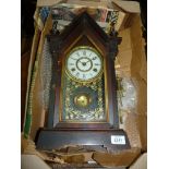 A Jerome wooden cased and glass fronted eight day mantle Clock with key.