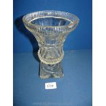 A clear glass faceted and hobnail cut vase with square base, 8 1/4" tall, small chips to corners.