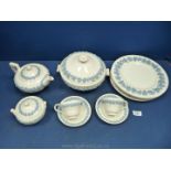 A quantity of Wedgwood embossed Queensware items in lilac on white including teapot, sugar bowl,