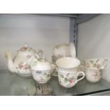 A Wedgwood 'Apple Blossom' Teaset for six with large bread and butter plate, teapot,