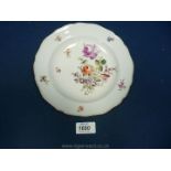 A Meissen porcelain floral plate, with crossed swords mark.