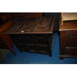 An unusual eastern design Blanket Chest decorated in relief with stylised foliage and having egg