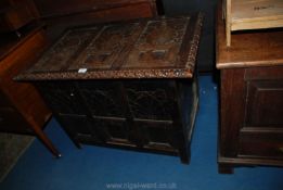 An unusual eastern design Blanket Chest decorated in relief with stylised foliage and having egg