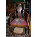 A very elegant Mahogany and Walnut framed Elbow Chair having shaped splat,