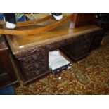 A good carved Oak double pedestal Desk having inset Rexine type top,