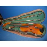 A violin with two bows, canvas covered case, 23 1/4" long, all a/f.