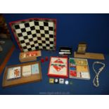 Miscellaneous games including playing cards, wooden draughts, Monopoly (no board) etc.
