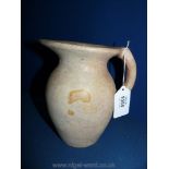 An Alabaster jug, cream/red, 7" tall,