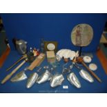 A large box of miscellaneous items including metal Harrods shoe stretchers, shells, metal teapot,