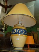 A large yellow and blue Louis Drimmer table lamp and matching shade.