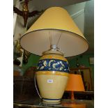 A large yellow and blue Louis Drimmer table lamp and matching shade.