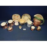 A box of china to include a large Toby jug of Scrooge, Beswick ware, commemorative cups,