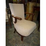 A pre 1950 bentwood framed low Armchair having brown shadow patterned upholstery