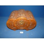 A small carved Chinese camphorwood box.
