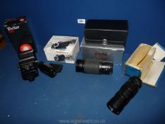 A Vivitar 285 zoom Thyristor automatic flash, a Sigma 75-300 zoom lens in new case and box,