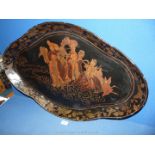 An 18th Century lacquered papier mache lozenge shaped tray with shaped rim,