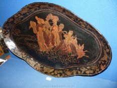 An 18th Century lacquered papier mache lozenge shaped tray with shaped rim,