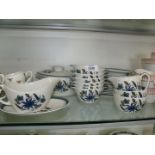 A quantity of Alfred Meakins dinner and tea ware, blue floral pattern on white ground.