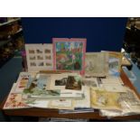 A box of art clippings, books, calendars, stencilling book etc.