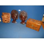 Three wooden masks plus an oriental wooden box.