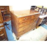 An early 19th century Mahogany Chest of 3 long and 2 short drawers having swan-neck drop handles