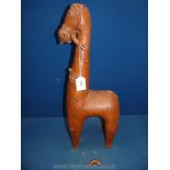 A large stylized pottery figure of a horse late 19th-early 20th century; losses and repairs;