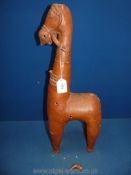 A large stylized pottery figure of a horse late 19th-early 20th century; losses and repairs;