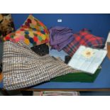 A quantity of fabric including patchwork velvet skirt, woollen blanket,