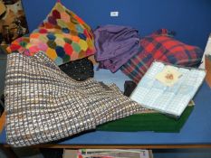 A quantity of fabric including patchwork velvet skirt, woollen blanket,