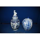 Two blue and white Ginger Jars, one by Delft with dog finial to lid,