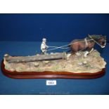 A Border Fine Arts 'Logging' B0700, on a loose base, the horse having slight damage to ear,