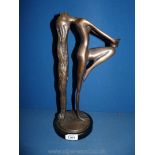 A bronzed lady candle holder, 14" tall.