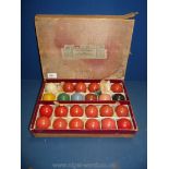 A box of billiard balls, in original box, Soho square, London.