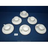 A Royal Worcester porcelain coffee set, including six cups and six saucers, white, gold rimmed.