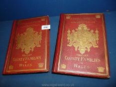 Two red leather bound volumes - ''County Families of Wales''.