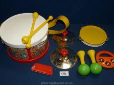 A Fisher Price drum set.