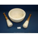 A large pestle and mortar with two mortar.