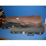 Two junior violin cases and one full size one.