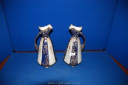 Two Victorian Jugs in royal blue and gold with floral decorated panels, a/f (rubbing to gilding,