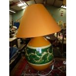 A medium orange and green Louis Drimmer table lamp and matching shade.